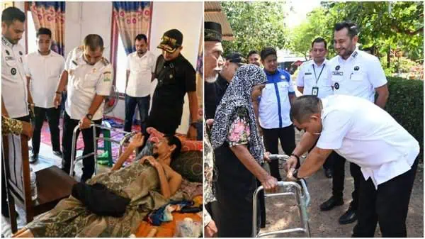 Pj Bupati Aceh Besar Muhammad Iswanto menyerahkan bantuan tongkat empat kaki kepada Yusri Affan dan ibu Radhian warga di Gampong Lam Me, Kecamatan Blang Bintang, Rabu (3/7/2024). Foto: Istimewa